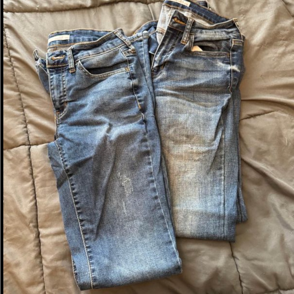 two pairs of bootcut jeans. Selling both together